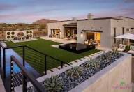 Luxury Phoenix backyard with pool, artificial turf, and desert landscaping